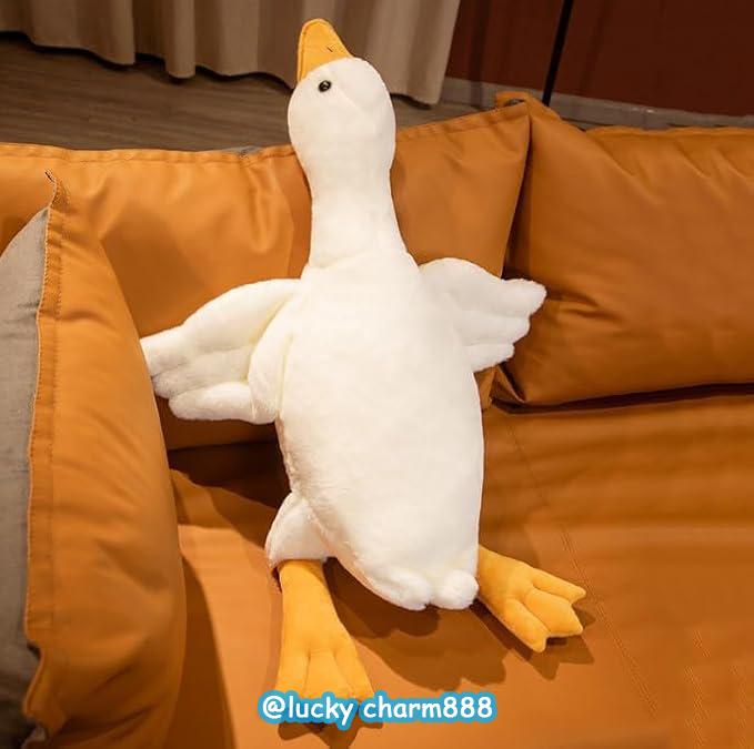 Cute Big White Goose Plush Pillow Toy! Large and irresistibly huggable, it's a favorite for both kids and adults. Suitable for all beds, offering coziness whether you cuddle or clamp it. A practical and sweet sleep companion.