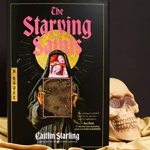 The Starving Saints: A Novel by Caitlin Starling [Hardback Book] The Starving Saints: A Dark Medieval Tale of Survival, Divine Intervention, and Unraveling Mysteries Amidst a Castle's Descent into Madness