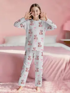 White background with pink bear and bowknot all-over print, cute 2-piece girls' digital printed long-sleeve pajamas with long pants, made of flame-retardant fabric. A fashionable, trendy, casual, comfortable and soft pajama set, suitable for sleeping and