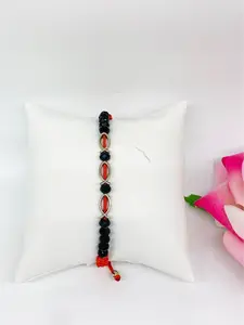 fish bracelets with black beads on red thread