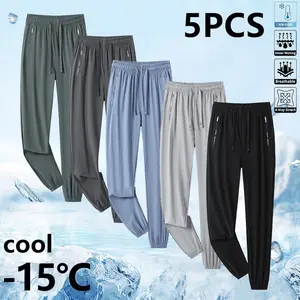 Pack of 5 women’s casual athletic jogger pants made from ice silk, quick-drying fabric, with zippered pockets and an upgraded elastic waistband for comfort. Breathable and lightweight, suitable for hot weather outfits—ideal for commuting, sports, casual w