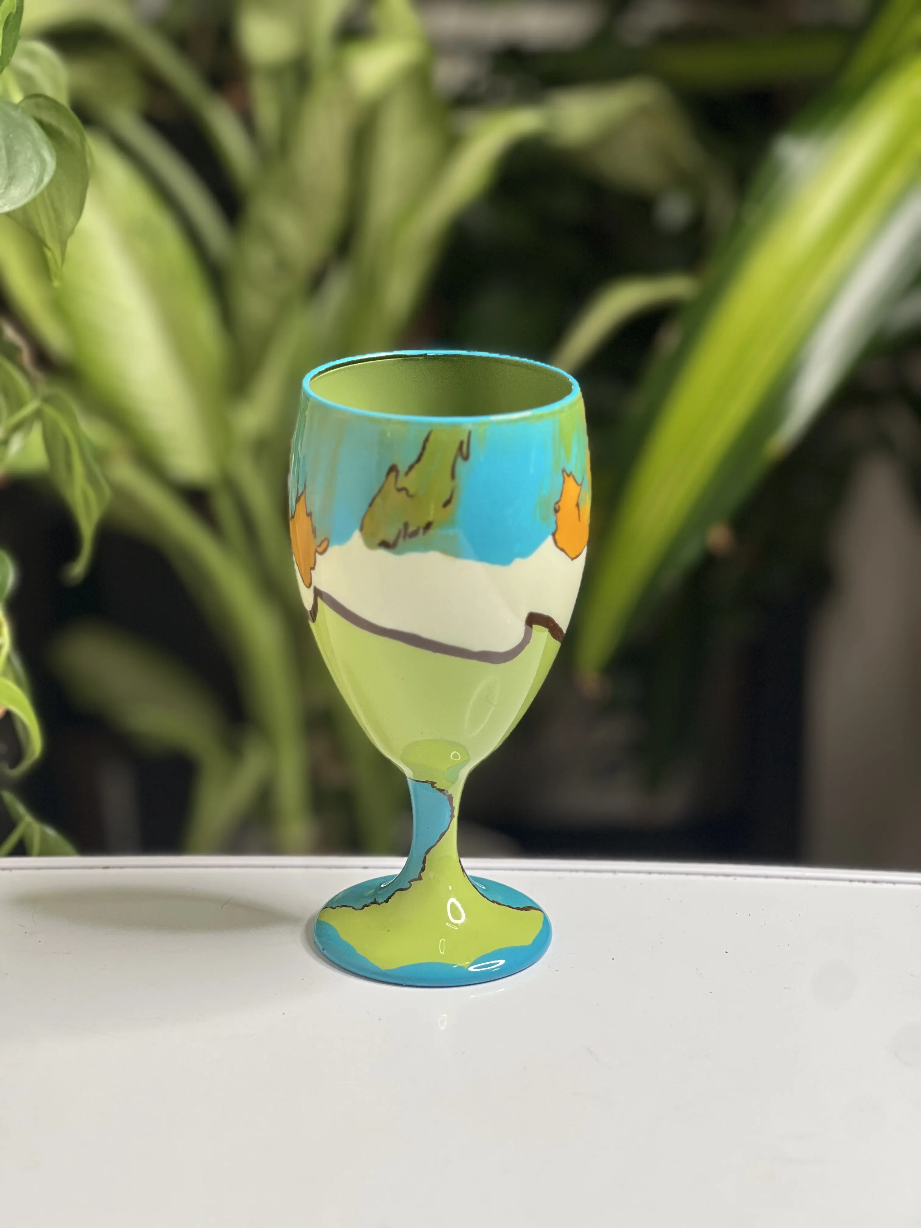 Painted Wine Goblet Vibrant Green & Blue Design with Unique Landscape Artwork for Elegant Dining Durable and Versatile Use Hand Wash Only