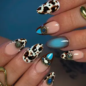 24pcs almond-shaped press-on nail gift set, featuring black and brown cow print French manicure design, embellished with vintage rhinestones and high-quality sapphire accents. Portable and perfect for parties. Elegant Rhinestone Decorated
