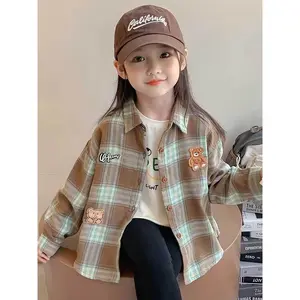 Trendy Plaid Embroidered Shirts for Young Girls, Perfect for Early Autumn. These Stylish Long-Sleeve Tops Feature Fun Cartoon Designs, Blending Sweetness with a Cool Vibe, Suitable for Casual Wear And Versatile Outfits