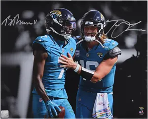 Trevor Lawrence and Brian Thomas Jr. Jacksonville Jaguars Autographed 16" x 20" Teal Spotlight Photograph - Fanatics Authentic Certified
