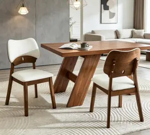 2 walnut colored solid wood dining chairs,PU soft packaging on the backrest and seat cushion, hollowed out design backrest, for home dining chairs.