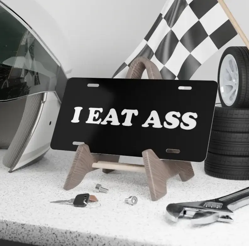 I EAT A** Funny License Plate - Black Aluminum Front Vanity Car Tag - Rude Sarcastic Adult Humor Gag Gift, Hilarious Meme Car Accessories for Men, 12x6 Inch