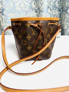 Pre-owned Louis Vuitton canvas Crossbody Bags Nano Bucket Bag Brown with Gold Accents, Adjustable Strap, and Drawstring Closure