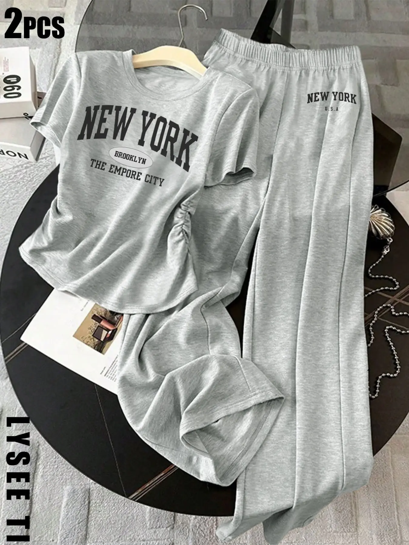 Summer new light gray letter short sleeved set with pleated design T-shirt and hanging wide leg pants, loose and casual for home and outdoor wear, comfortable and fashionable women's two-piece set Top