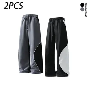 Spring/Autumn men’s long pants featuring deconstructed patchwork and contrasting colors—trendy, versatile for everyday sports and fitness, loose casual straight-leg design.