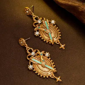Vintage Medieval Emblem Earrings Ornate Gold-Tone Statement Jewelry with Sparkle Accents and Intricate Design