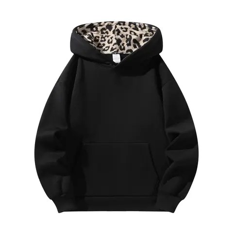 Retro color blocked pullover hoodie sweatshirt with a relaxed drop shoulder fit, solid black body and leopard print lining inside the hood, front kangaroo pocket—casual streetwear for city outings and hip hop layering.