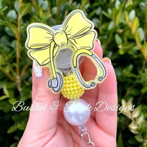Yellow Coquette bow badge reel