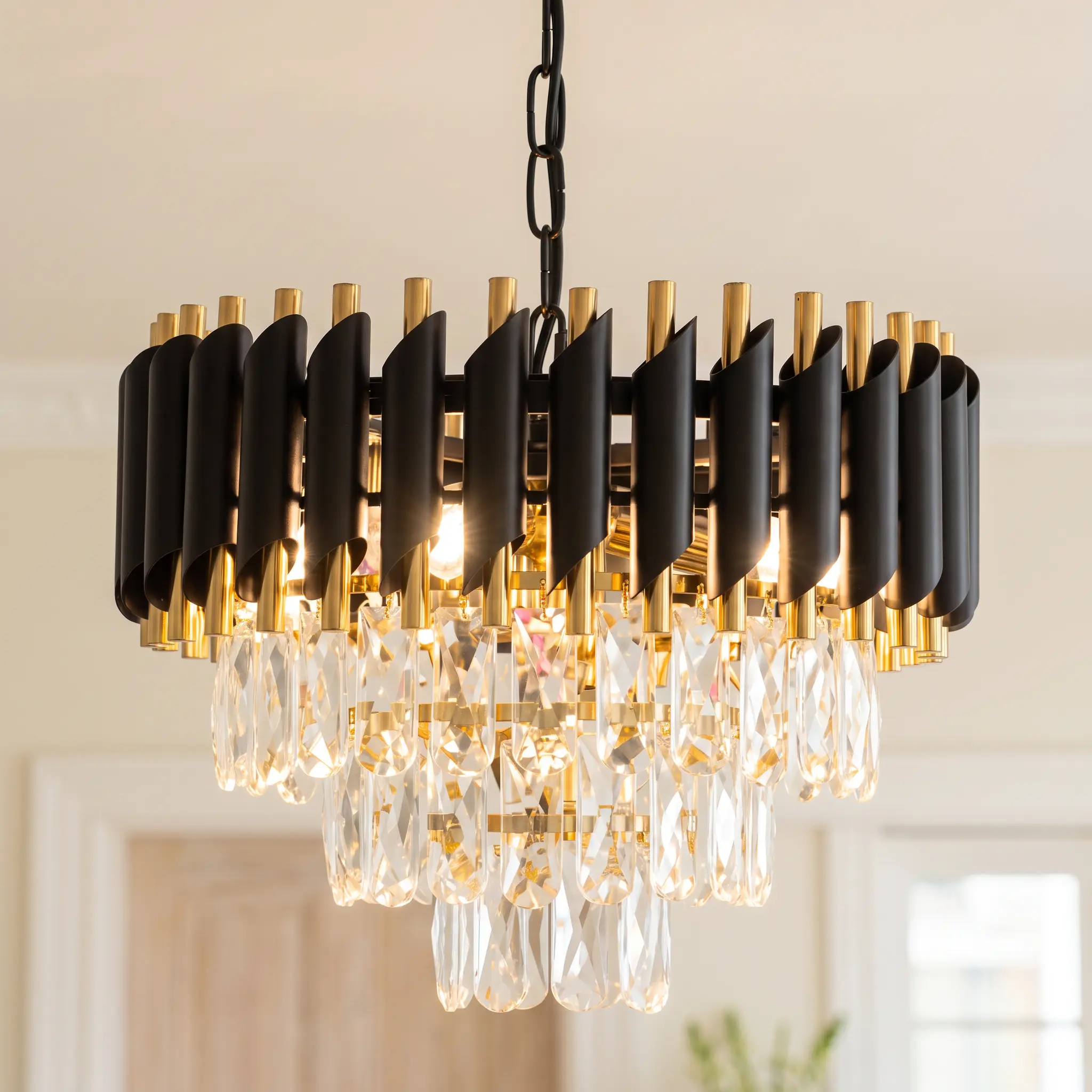 Modern Black & Gold Crystal Chandelier, 3‑Tier Raindrop K9 Crystal Pendant Light, Adjustable Hanging Chain, Glam Metal Frame, Compatible with Dimmable E12 Sockets, Light Fixture for Kitchen Island, Dining Room, Living Room, Bedroom, Hallway
