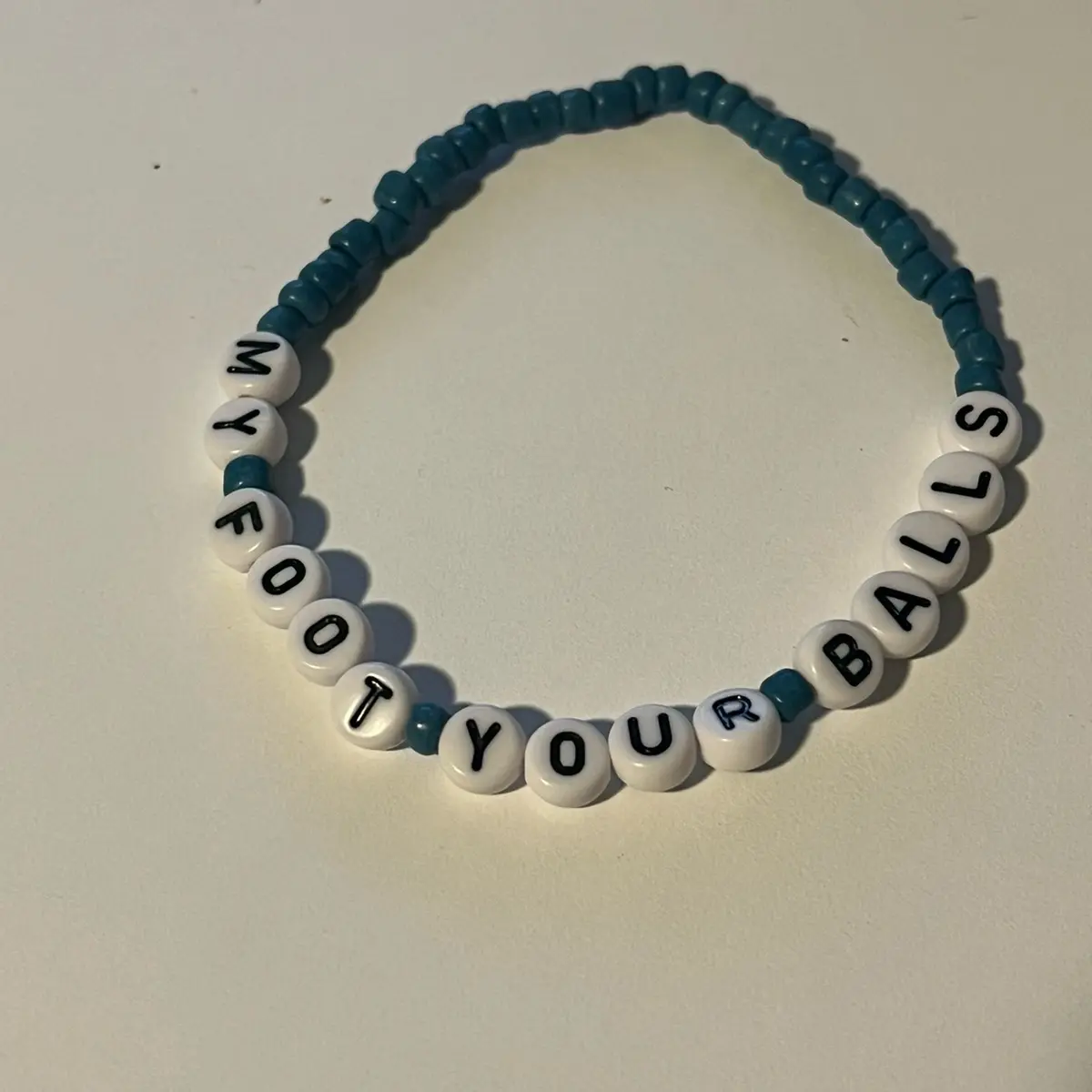 My foot your balls bracelet. Blue bracelet movement