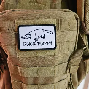 Duck puppy duck billed platypus white meme funny  2"x3" morale patch with hook and loop backing