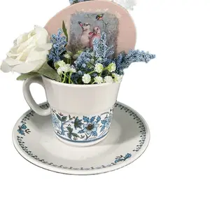 Vintage Tea Cup/Saucer filled with faux flowers/wood Easter Egg/decoupage with bunnies/bird
