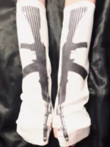 These Sweet & Savage long knit gloves feature an edgy gun print for a unique street style. Perfect for a steampunk inspired look or adding a rebellious touch