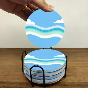 6-piece ceramic coaster set, featuring a circular natural motif of water ripples and clouds. Heat-resistant, non-slip coasters with holders, perfect for home, dining, and as beverage mats.