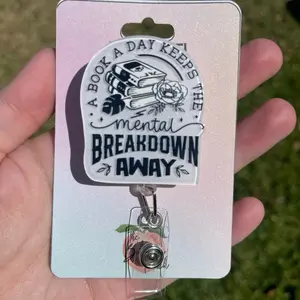 Badgereel Book Theme Badge Reel - "A Book a Day Keeps The Mental Breakdown Away" with Cartoon Book Design, Durable Acrylic, Secure Attachment #badgereel #bookish #bookmerch