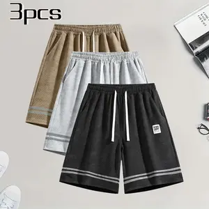 3-pack men’s shorts with waffle texture — summer casual loose mid-length shorts featuring a retro plaid double-stripe design, STAR LIGHT label decoration, elastic waistband with drawstring; versatile fashion sports shorts set.