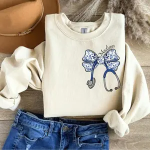 [Custom Name] Nurse Toile Bow Sweatshirt, Stethoscope Coquette Nurse Crewneck, Cute Nurse Bow Sweater, Personalized Nurse Gift, Aesthetic Sweatshirt