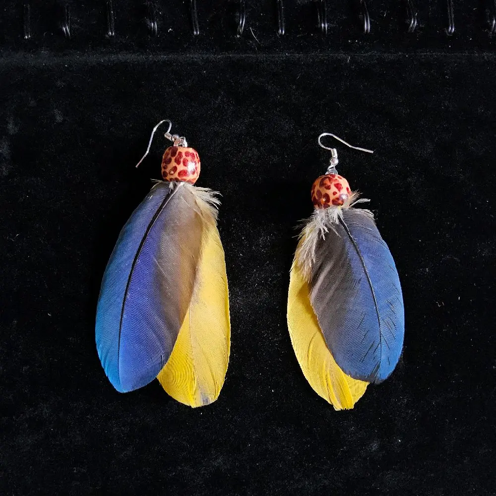 "Charlie girl feather earings"