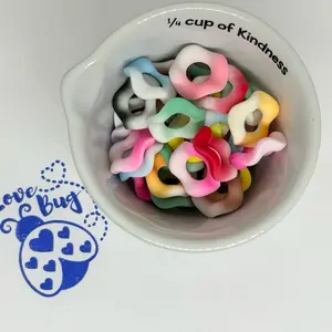 35 pieces 15mm mixed wide hole wavy acrylic spacers. Perfect for pens, keychains, wristlets, car, charms, key, charms, cup charms or any other DIY project.