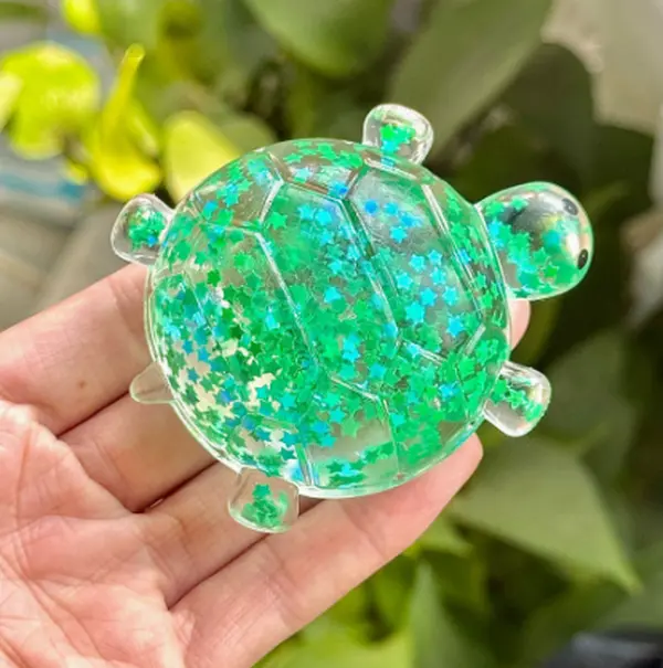 Cute little green turtle squeeze selfie accessory