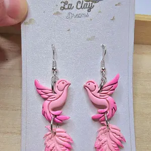 Handmade Birds Polymerclay Earrings - Pink Design with Feather Accents,  and White dove on a rocky texture cross.