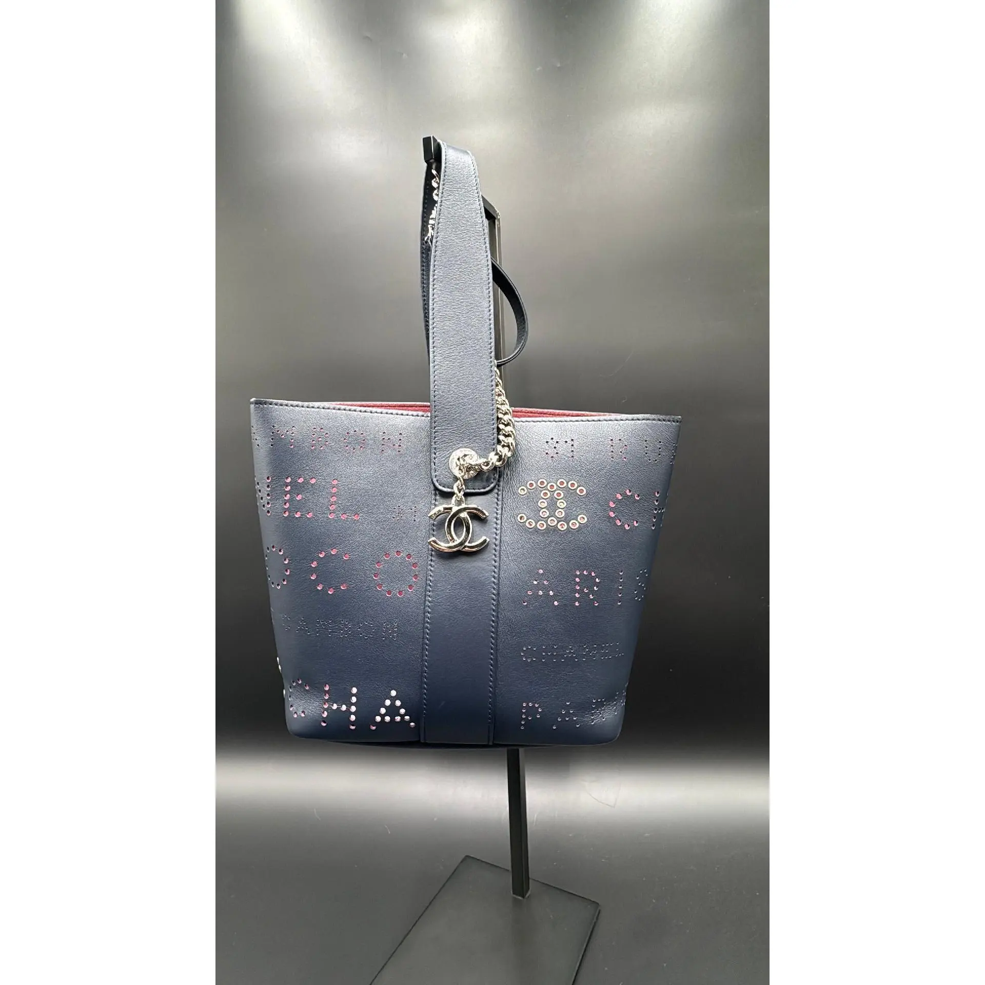 Pre-owned CHANEL Leather Luxury Bags & Accessories Small Perforated Logo Eyelet Bucket Bag, Navy Blue Date Code: 27358027. Entrupy ID: C6W8X7D.