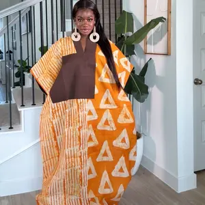 The Rich Auntie Dress - Casual Womenswear with Vibrant Orange and Brown Triangle Pattern