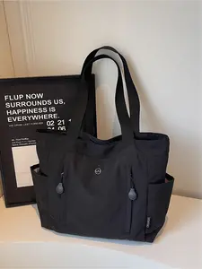 The large capacity soft commuter tote bag, is lightweight, spacious, suitable for daily use. It is a neutral waterproof nylon shoulder bag with a spacious interior suitable for 15 inch laptops, multiple side pockets, and a comfortable adjustab