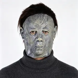 Weathered pale silent human latex mask with attached dark brown hair, creepy faceless villain headgear for haunted house jump scare pranks