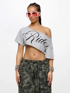 "Rider" Print Off-Shoulder Cropped T-Shirt, Womenswear, Y2K Streetwear & Casual Vibe. This short-sleeve tee features an off-shoulder neckline, bold cursive "Rider" lettering, and a cropped hem. The soft fabric creates a laid-back silhouette