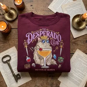 Desperado Club Embroidered Sweatshirt Fantasy Cat Crewneck Cozy Gamer Sweater Retro RPG Inspired Pullover Cute Adventure Embroidery Shirt Dungeon Style Sweatshirt Nerdy Fantasy Gift for Gamers Readers Cat Lovers Unisex Cottagecore Fantasy Fashion Top