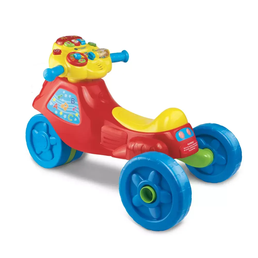 VTech 2-in-1 Learn and Zoom Motorbike Push Ride-On Toy Tricycle for 12-36 Mo, with Motion Sensor, Lights & Music, AA Battery-Operated (Batteries Not Included)