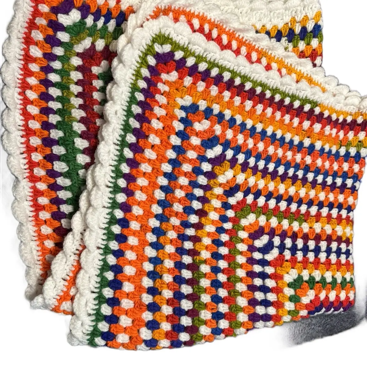 Granny square blanket with ruffled edge