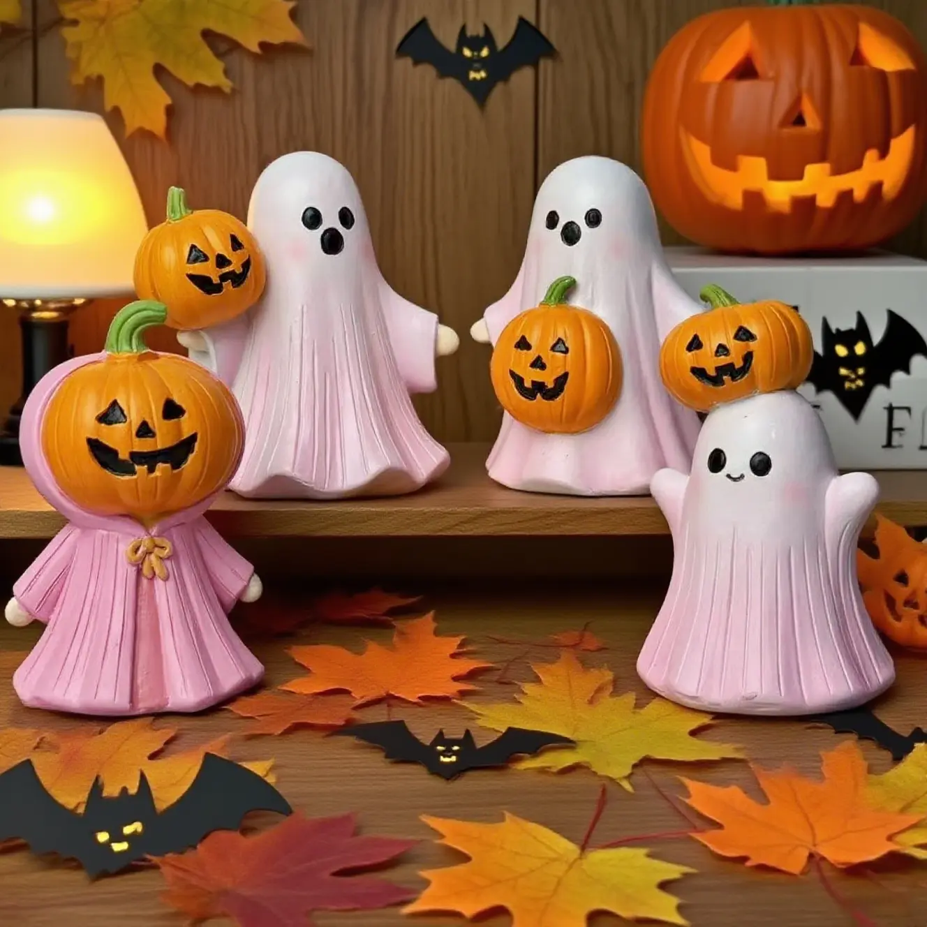 A pink pumpkin-headed ghost, a creative and cute Halloween pink ghost pumpkin ghost desktop decoration, a small gift for friends and family to easily create a Halloween atmosphere, a resin handicraft decoration