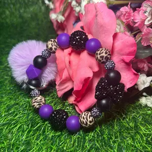 Loyal sass wristlet in the color scheme dark purple, leopard print, black and bling beads made with wire