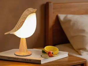 Compact cordless bedside lamp with touch control, 3 brightness levels, rechargeable LED design. Ideal for bedroom, office and dorm use.