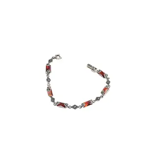 Elegant 925 sterling silver bracelet featuring a classic marcasite design with violet or red stones for a sophisticated and eye-catching look