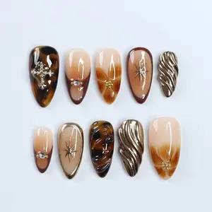 Fall Press On Nails with Tortoise Shell and Gold 3D Accents, Medium Almond Brown and Nude Nails with Starburst and Textured Chrome Design