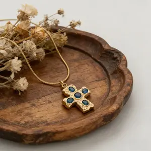 "Retro Gemstone Cross" Snake Chain Necklace: Featuring an antiqued, textured cross pendant set with natural iridescent gemstones, paired with a snake chain. An accessory that captures the essence of vintage charm combined with French elegance.