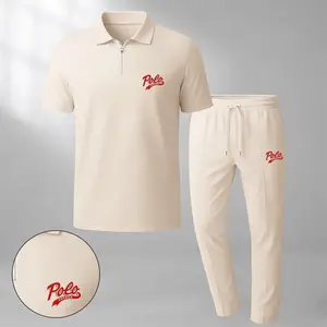Men's classic two-piece set—featuring a short-sleeve polo shirt with a zip collar and "USA" logo, paired with matching trousers—is crafted from breathable, soft-textured waffle-knit fabric. Designed with a relaxed fit, it is ideal for everyday