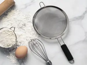 3-piece stainless steel fine mesh strainer set with insulated handles. Multi-use for sifting flour, rinsing rice, pasta and general food preparation, essential for kitchen baking and daily use.