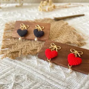 Micro Crochet Heart Earrings - Red & Black Options with Gold Bows and Pearl Accents on Wooden Display Boards
