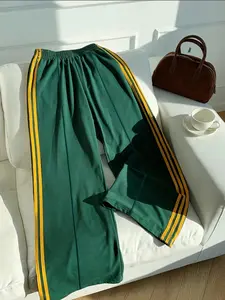 A pair of yellow striped drawstring wide-leg trousers Pants on the side of women's clothing, light and mature casual and energetic underwear, suitable for daily commuting, leisure street trips, light social gatherings, spring and summer vacations.