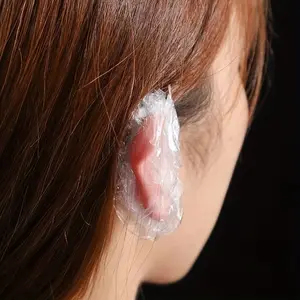 100pcs disposable waterproof ear covers – transparent, elastic protective covers with zipper closure, suitable for dyeing hair, taking showers, and spa treatments – essential accessories for hairdressers and beauty products.