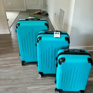 Luggage Set - Three Turquoise Luggage Cases with Wheels and Handles for Versatile Use